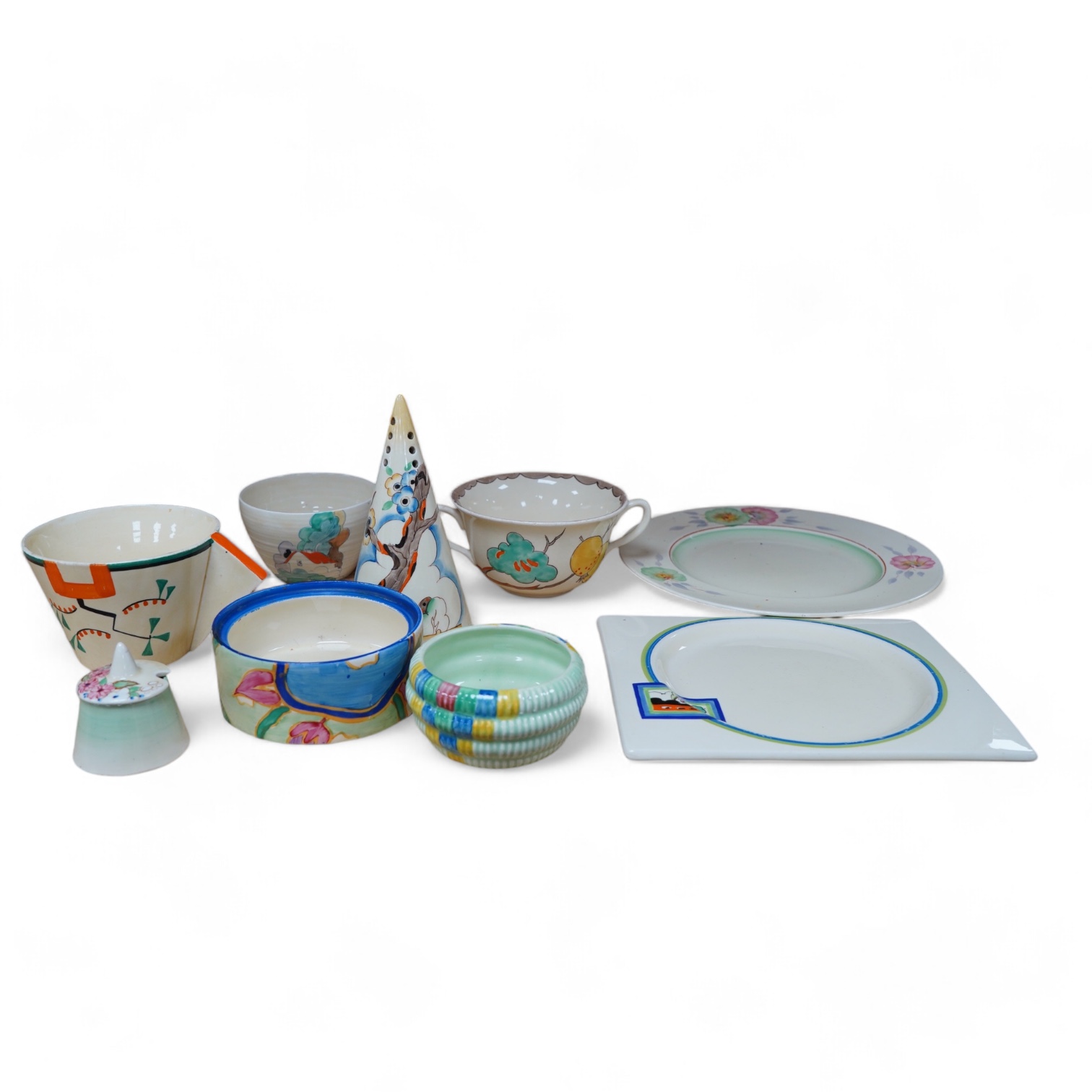A collection of Clarice Cliff including; a Tiger Tree conical sugar sifter (c.1937), a cup marked 5799, a two handled pomegranate cup, a bowl, two plates, a mustard pot, etc. Condition - fair